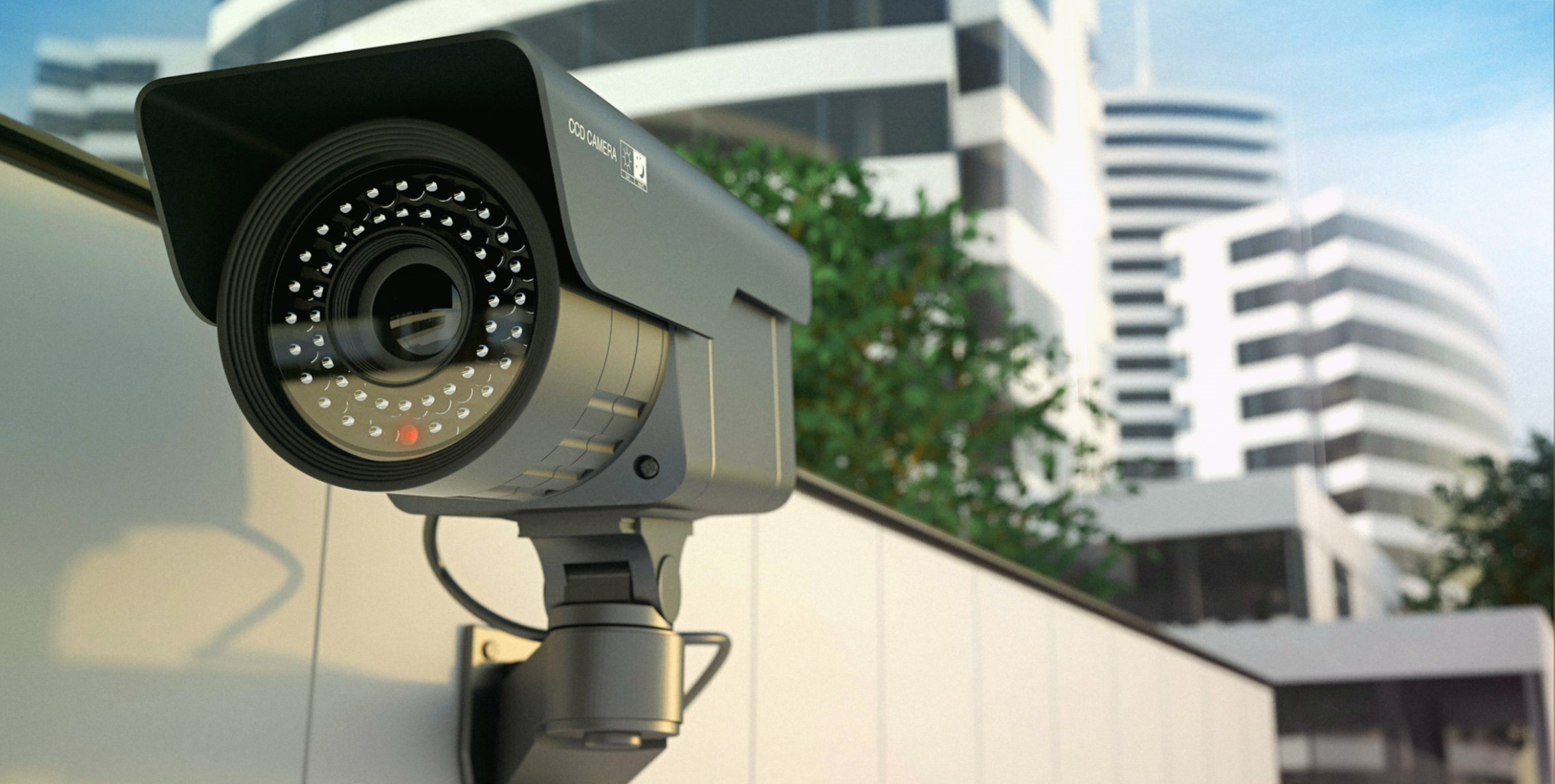 Modern surveillance camera installed on a building wall